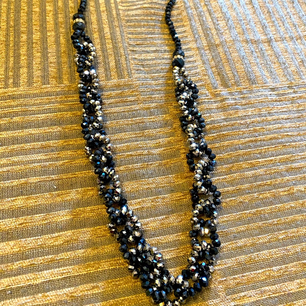 Long black and silver beads,